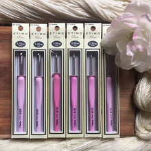 Load image into Gallery viewer, Artistic view of 6 Etimo Rose Crochet Hooks in their packaging